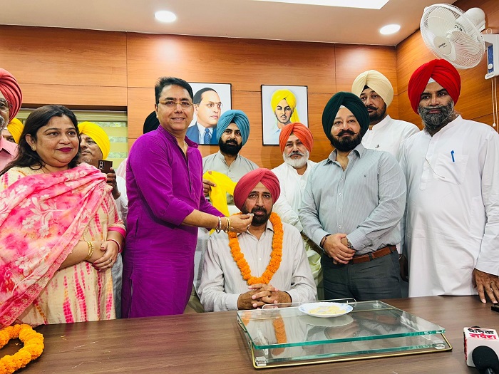 BALJINDER DHILLON ASSUMES OFFICE AS CHAIRMAN OF PUNJAB AGRO FOODGRAINS CORPORATION IN PRESENCE OF AMAN ARORA