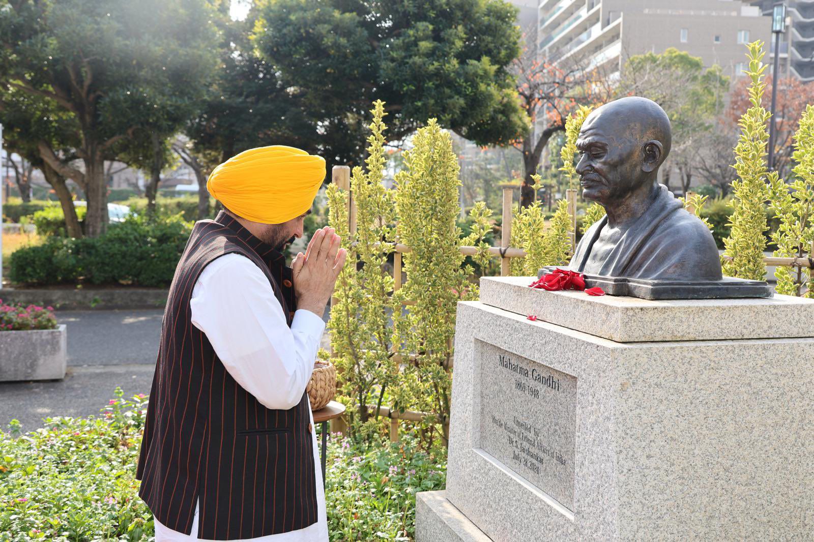 CM BEGINS HIS JAPAN TOUR, PAYS FLORAL TRIBUTE TO MAHATMA GANDHI AT EDOGAWA GANDHI PARK